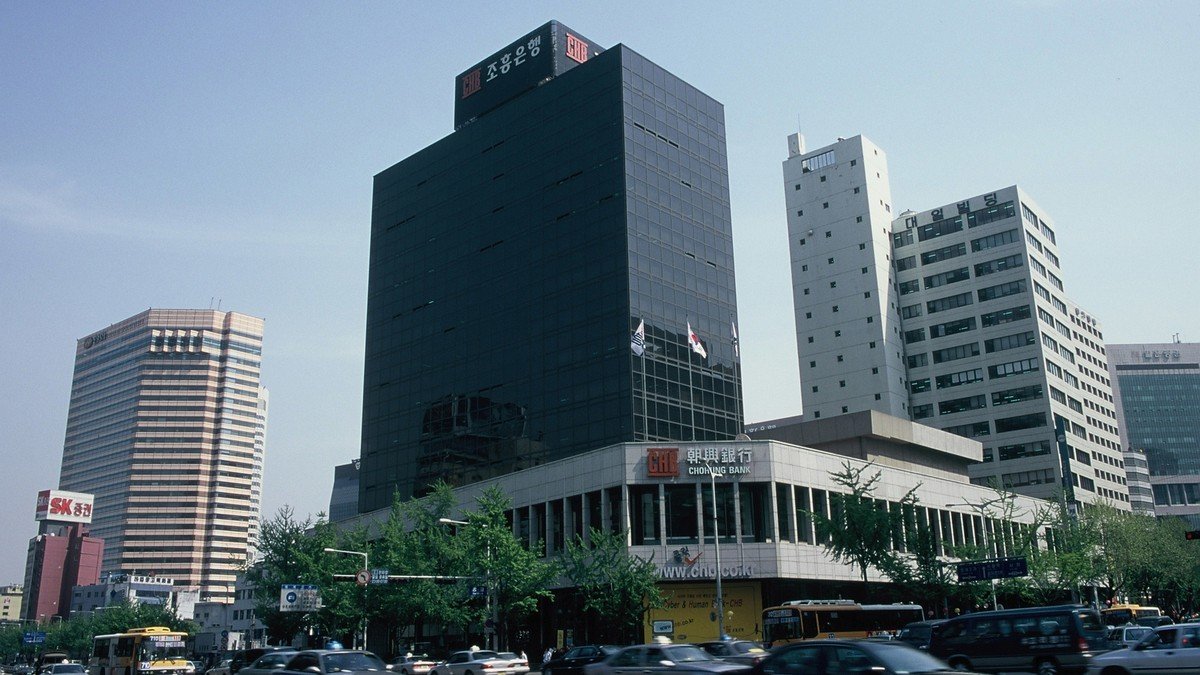 Bank of Korea headquarters building in downtown Seoul under clear blue skies