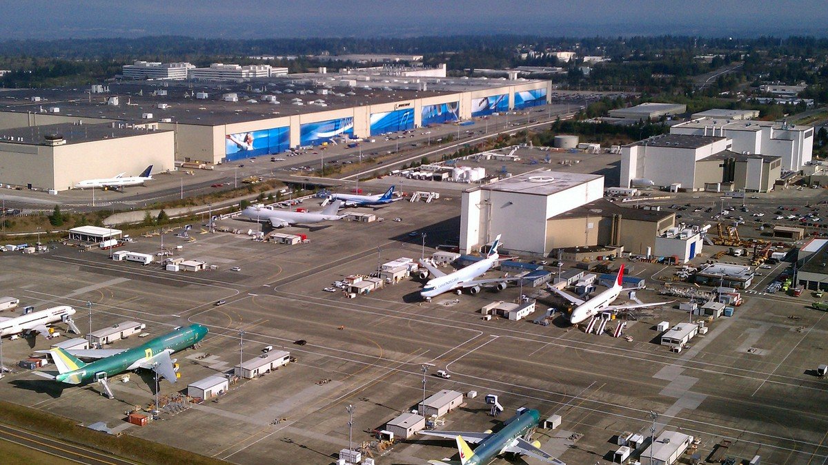 Striking Boeing machinists picket outside the Everett commercial aircraft assembly facility