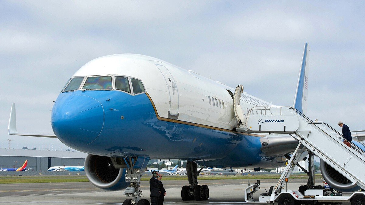 Striking Boeing aerospace machinists holding picket signs outside assembly plant