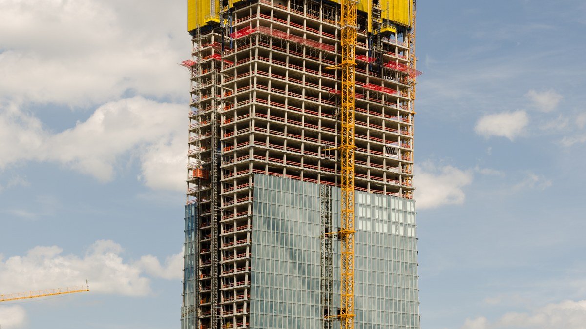 Headquarters of the European Central Bank with the euro symbol sculpture in Frankfurt, Germany