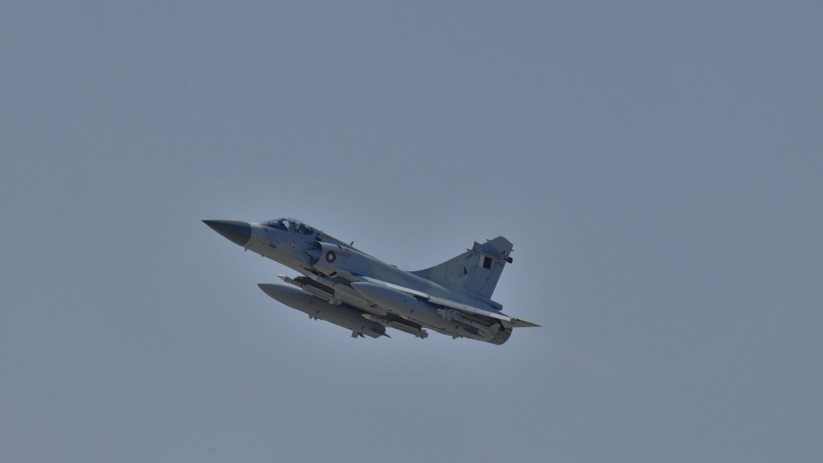 French Dassault Mirage 2000 fighter jet flying against blue sky