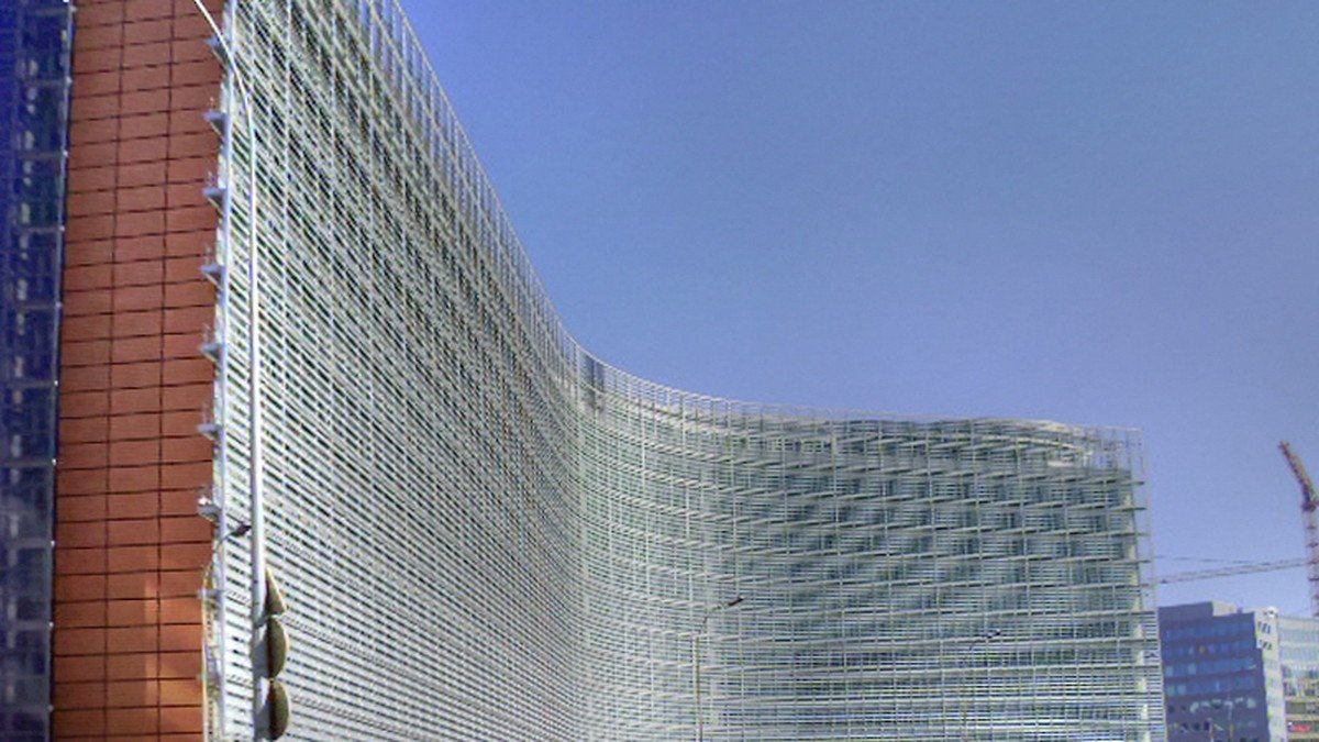 Exterior view of the Berlaymont European Commission headquarters building in Brussels under blue skies