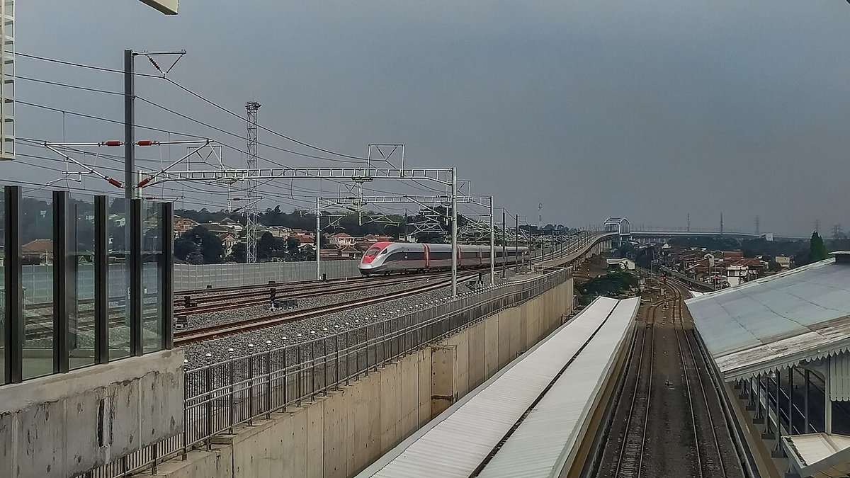 The sleek red and silver Whoosh bullet train at Halim Station in Jakarta