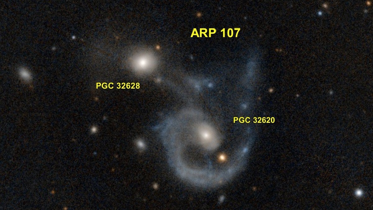 James Webb Space Telescope view of two colliding galaxies linked by cosmic dust filaments like a glowing smile