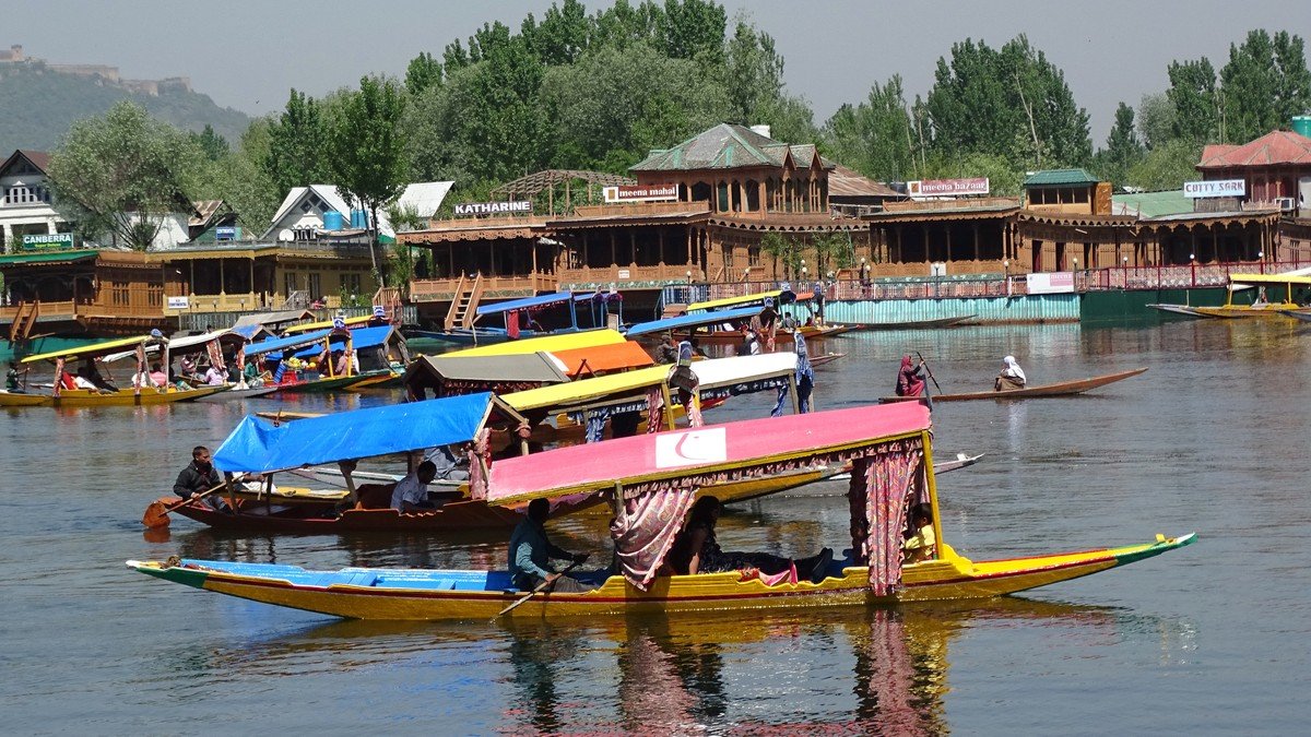 Voters and election officials at a polling station in Jammu and Kashmir during the Legislative Assembly elections