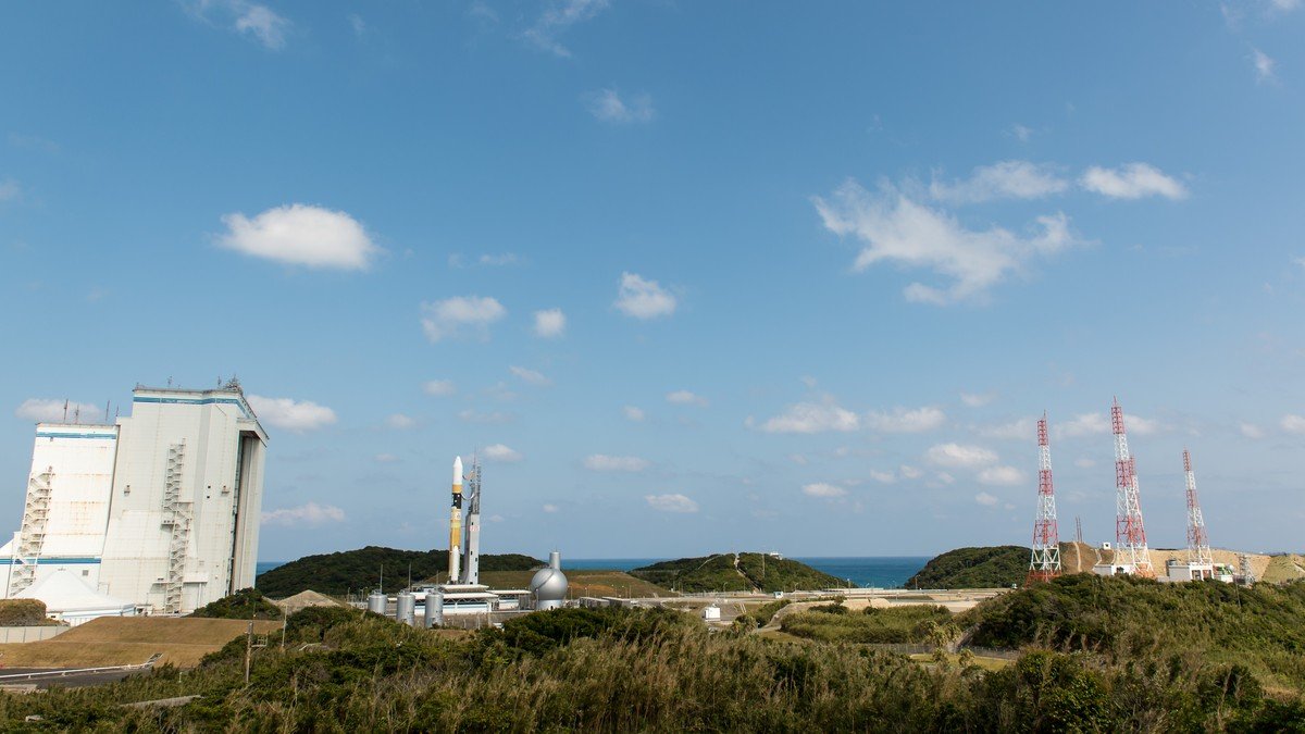 The H3 Flight 4 rocket on the mobile launch platform illuminated against the night sky at Tanegashima Space Center