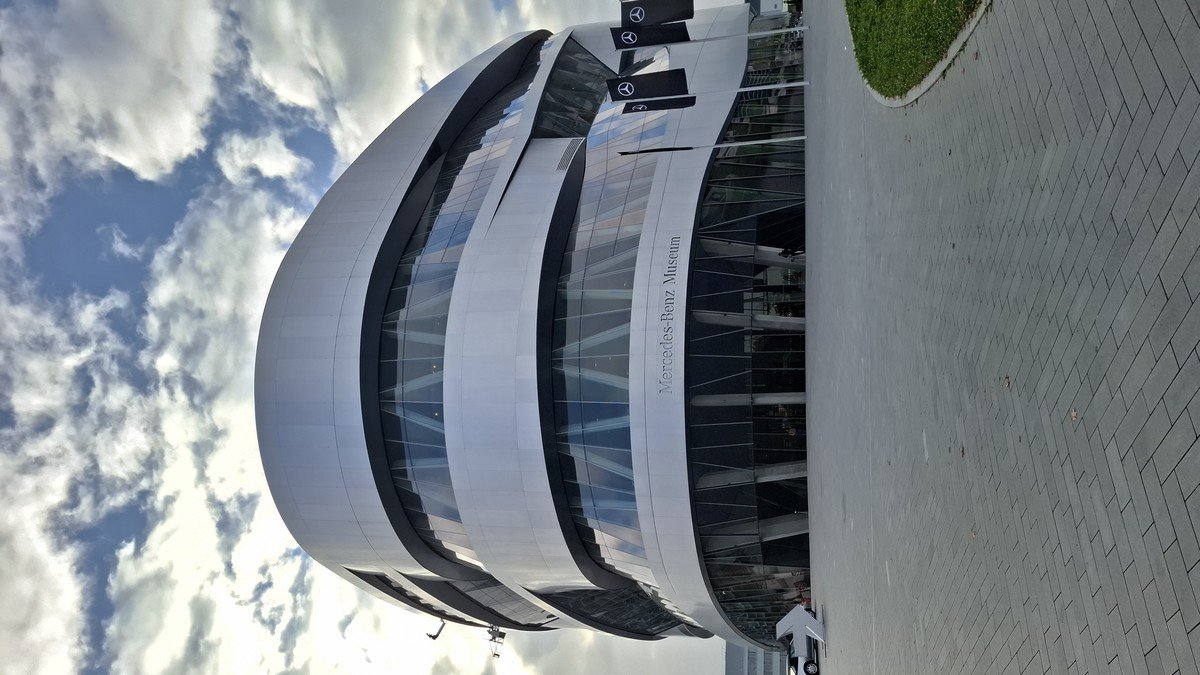 Mercedes-Benz corporate headquarters and luxury electric vehicles on display