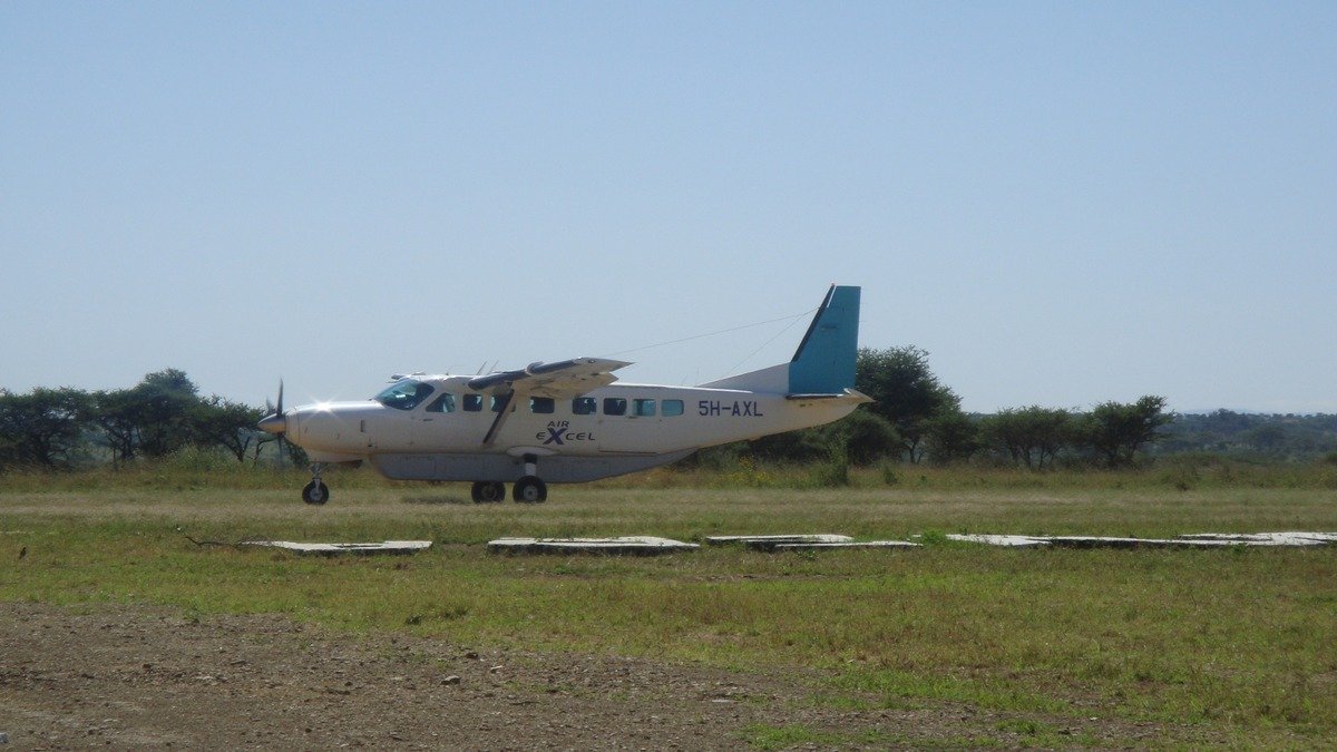 Remote mountain highland airstrip and light utility aircraft in Papua