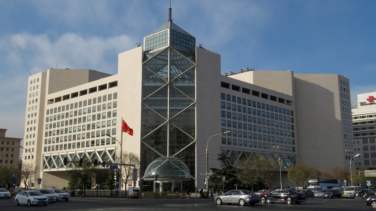 The headquarters of the People's Bank of China in Beijing illuminated under daylight