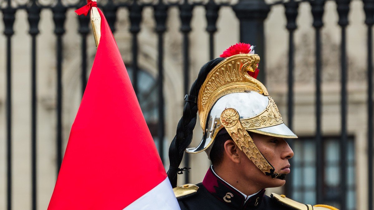Peruvian armed forces and police standing guard along a busy transit corridor in Lima Peru