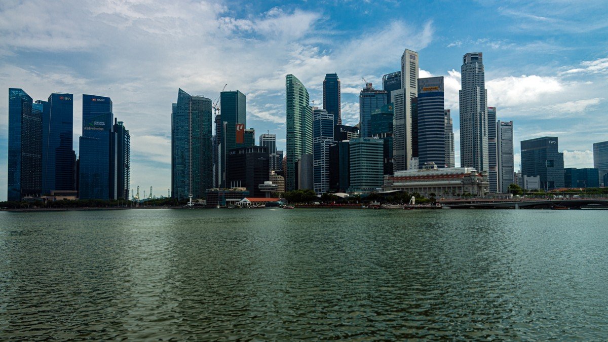 Singapore Marina Bay financial district skyline alongside digital banking graphics