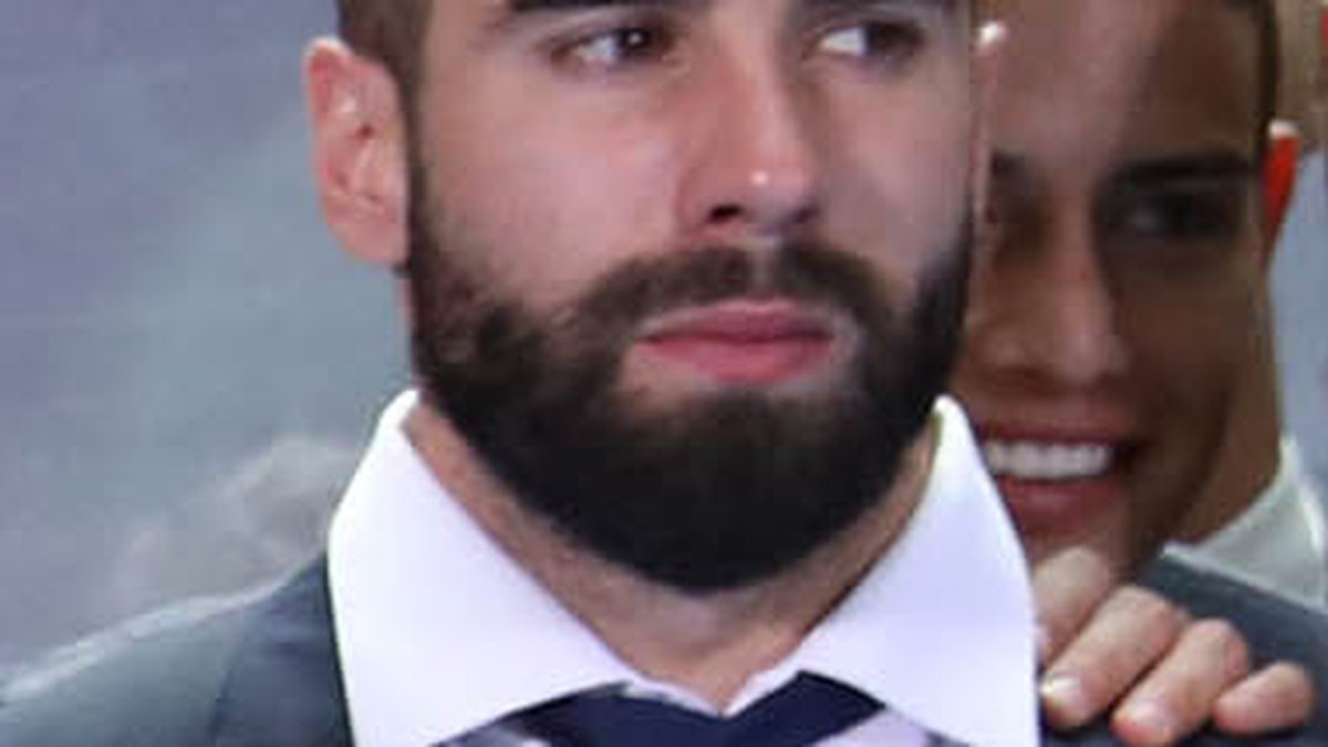Dani Carvajal receives medical attention on the pitch at the Santiago Bernabeu stadium