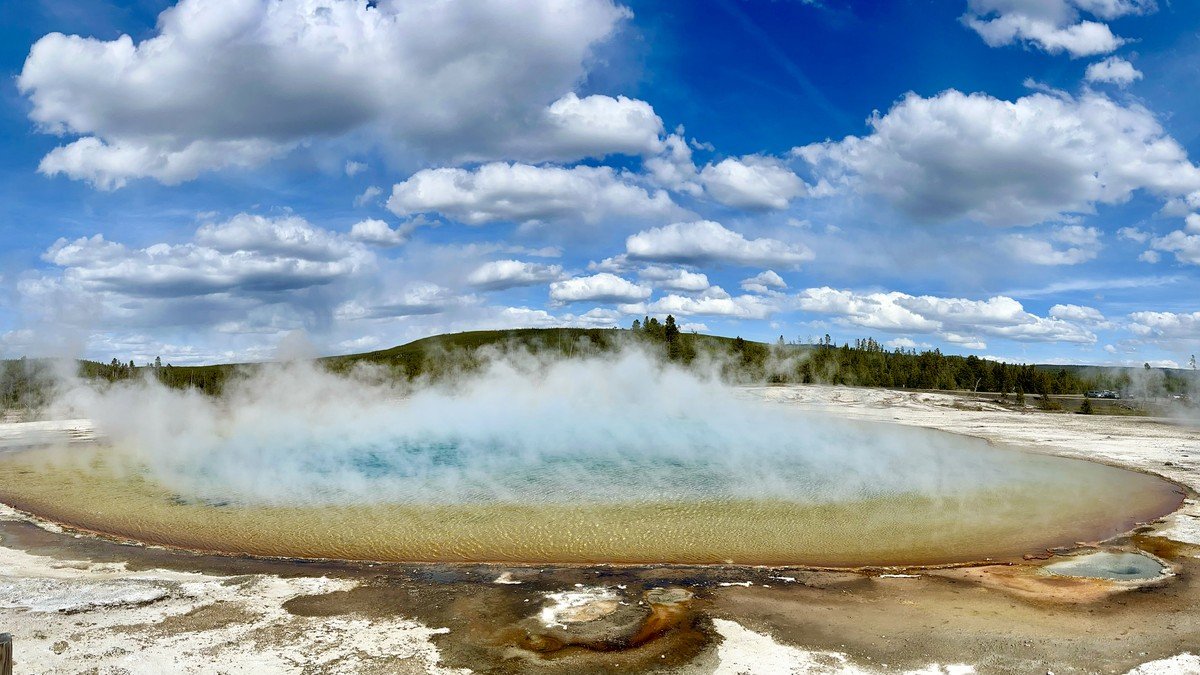 Aerial view of Grand Prismatic Spring and the volcanic landscape of Yellowstone National Park