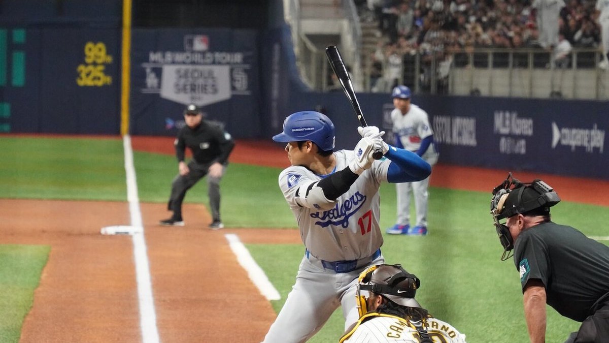 Shohei Ohtani celebrates while rounding the bases after hitting a three-run home run at Dodger Stadium