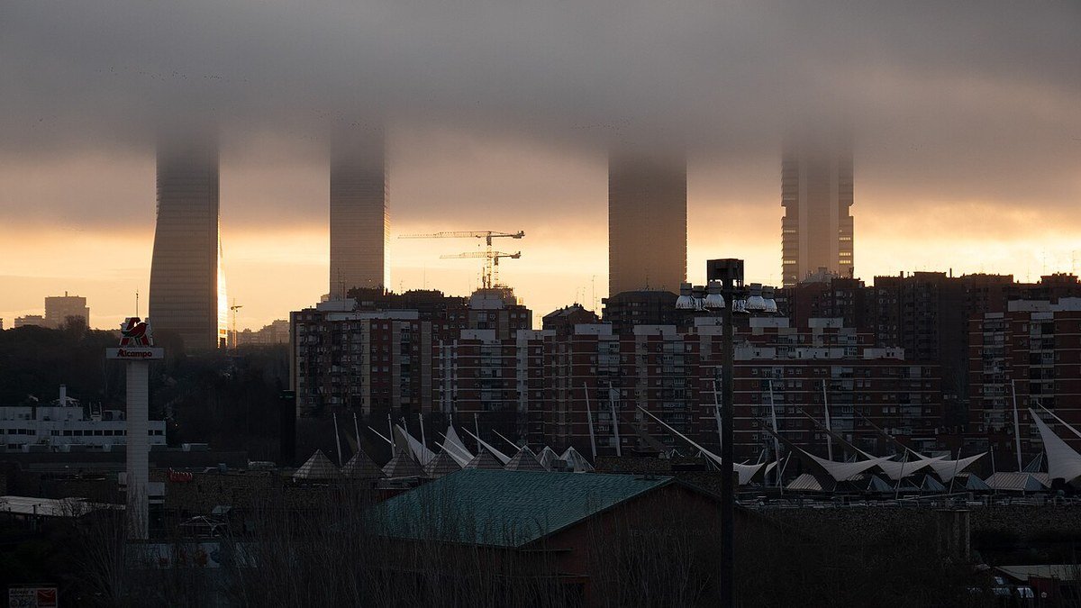 Madrid financial district skyline representing Spain's expanding employment and labor stability