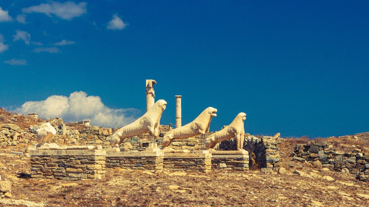 Ancient marble ruins and columns overlooking the turquoise Aegean Sea on the sacred island of Delos