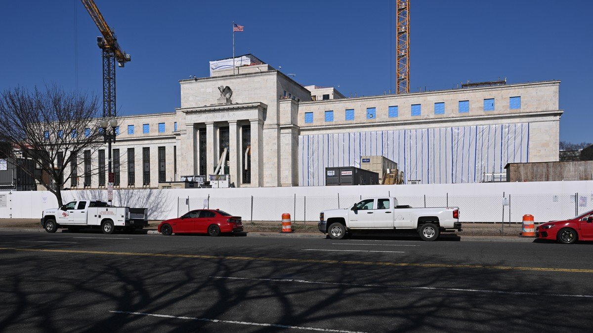 The Federal Reserve Eccles Building headquarters in Washington DC under blue morning skies