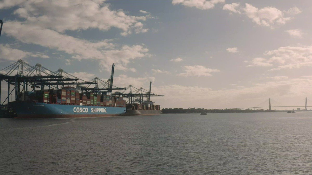 Commercial container gantry cranes lined up at deepwater port terminal